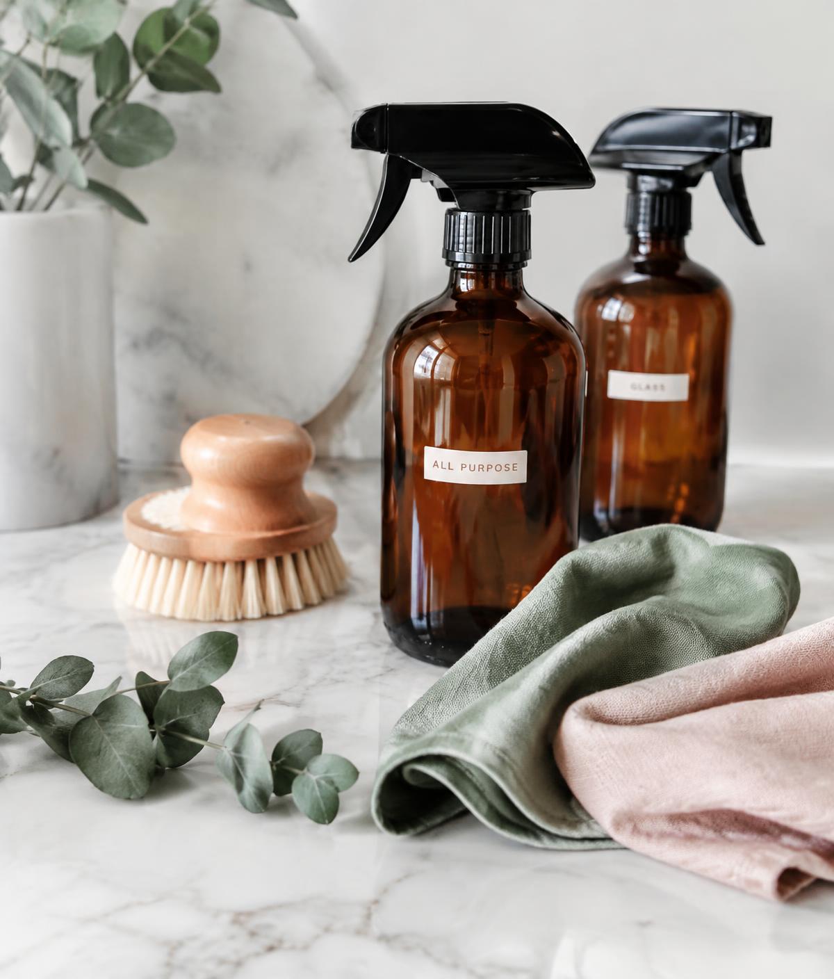 Natural cleaning supplies with sage and blush linen cloths